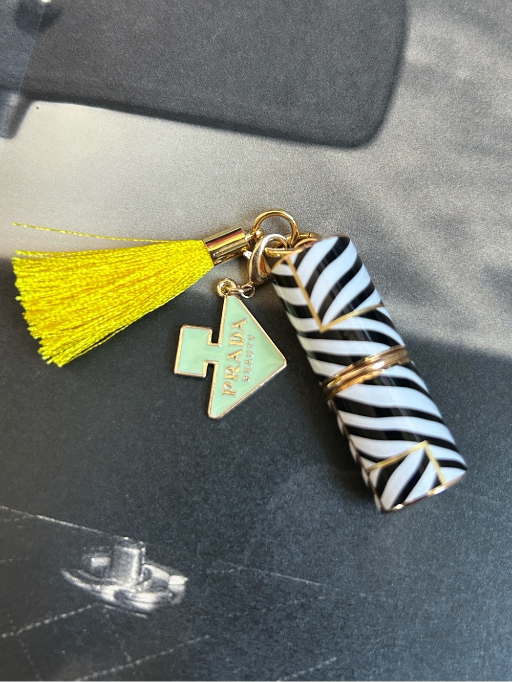 Carolina Herrera mini lipstick with tassels